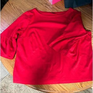 Red knit tee with ruffled cuffs